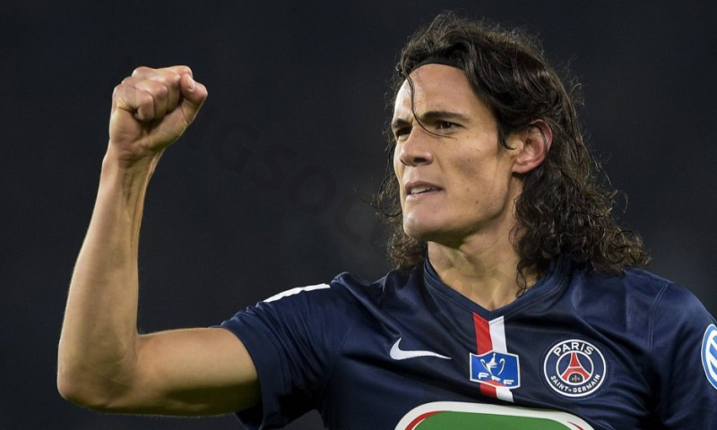 Edinson Cavani with long hair and headband stands out on the field