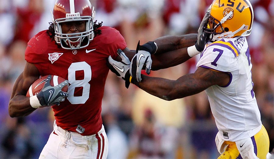 Julio Jones catching a football in Alabama uniform
