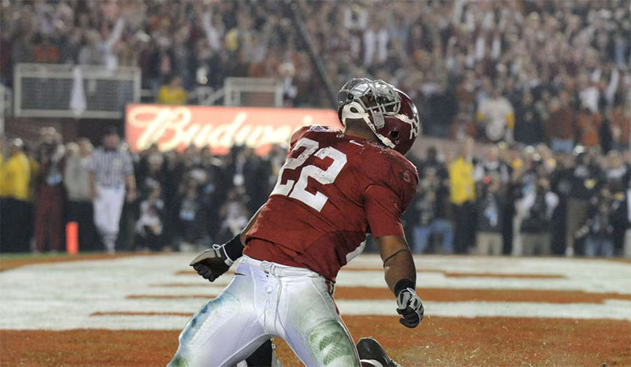 Mark Ingram II charging forward with the football